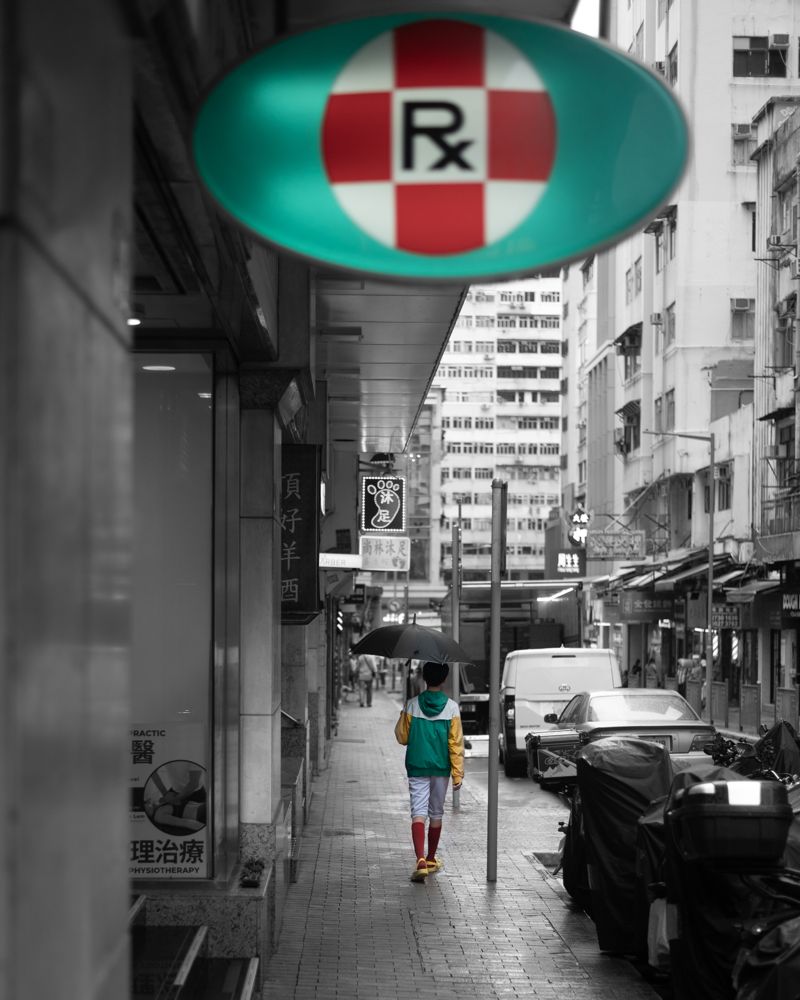 Umbrella and a pharmacy sign