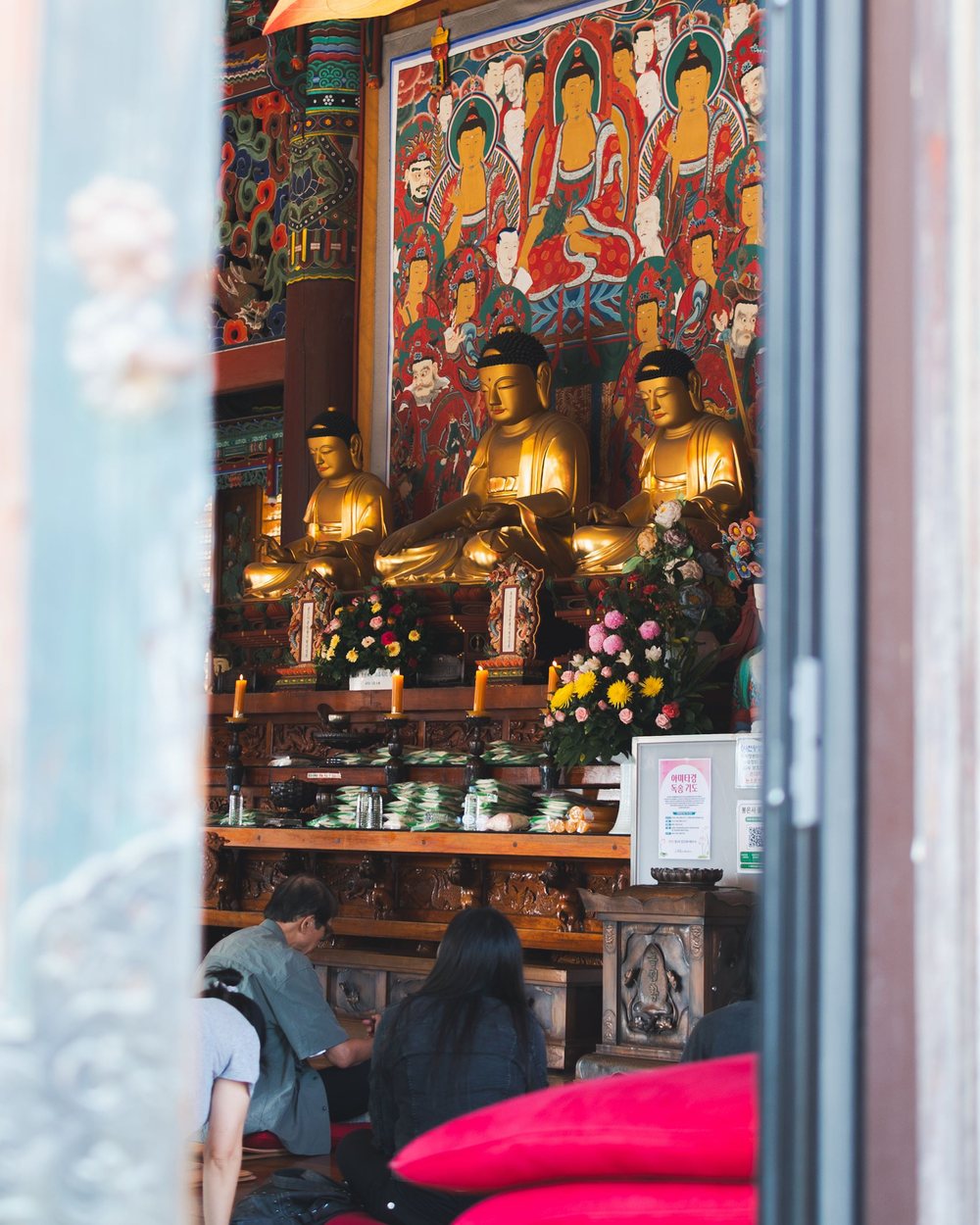 Buddhas through the doorway