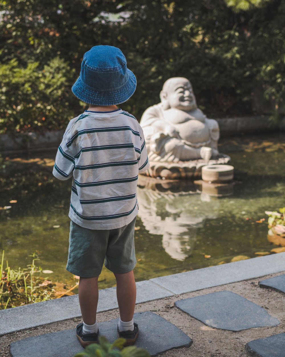 Blue hat, laughing Buddha